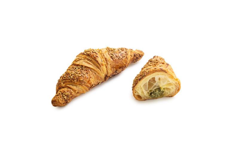 Pistachio filled croissant with pumpkin seed decoration